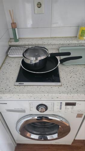 a pan sitting on top of a stove in a kitchen at Kiman09 in Seoul