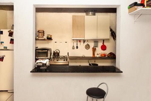 Η κουζίνα ή μικρή κουζίνα στο quarto Refúgio no Bosque