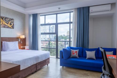 Postel nebo postele na pokoji v ubytování Swiss-Belinn Nairobi