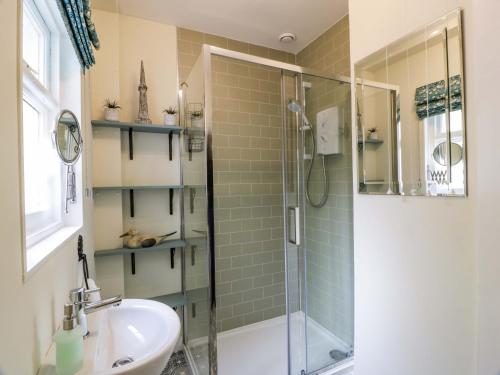 a bathroom with a shower and a sink at East Lodge - Crathes Castle in Banchory