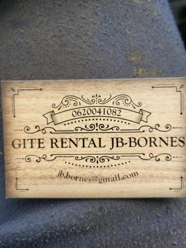 a wooden sign that says gift rental dominos at Le Blarsois in Blars