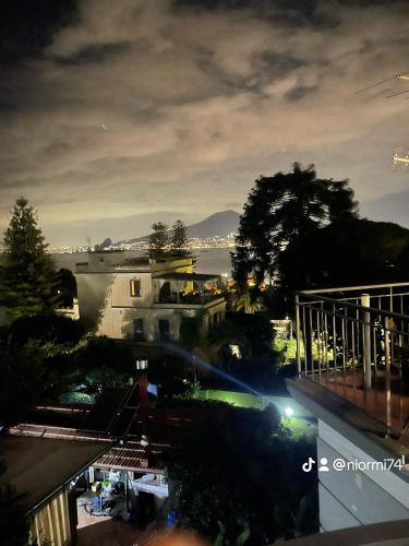 a view of a city at night at La Terrazza Quisisana Sorrento Coast in Castellammare di Stabia