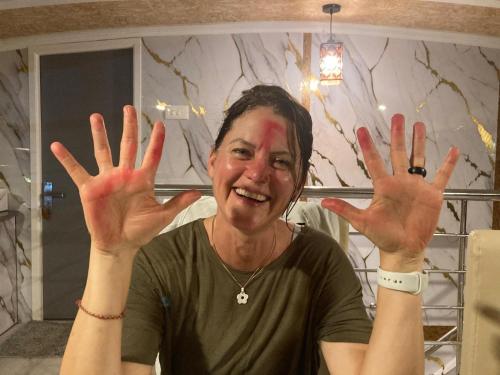a woman with her hands up in the air at Dreams Spectrum Luxury houseboat in Alleppey