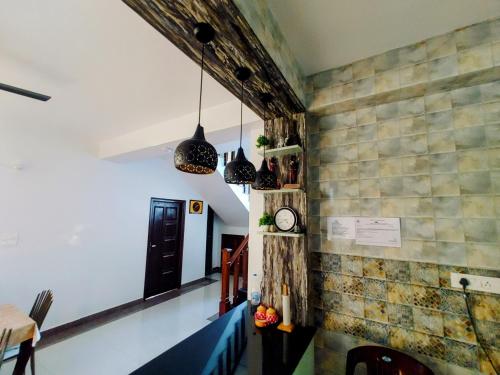 a dining room with tiles on the wall at Whispering Meadows U get entire 3 BHK in Shimla