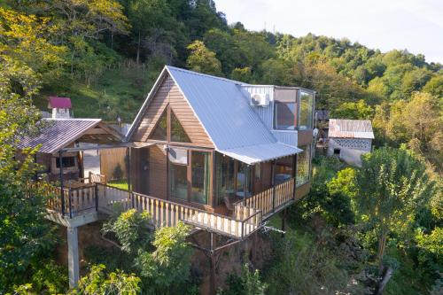 an overhead view of a house with a metal roof at chemi kera Chalet in Makho