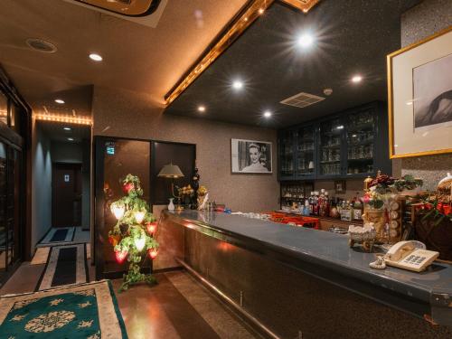 a bar with a christmas tree on the counter at Hotel New Century in Okinawa City