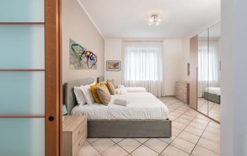 a bedroom with a bed and a mirror at Olimpic Vatican Home in Rome