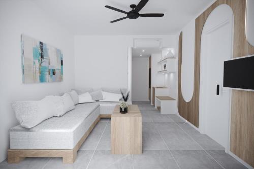 a living room with a couch and a table at Gaia Village in Tigaki
