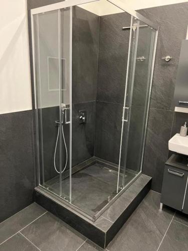 a shower with a glass enclosure in a bathroom at Best-Budged24 in Offenburg