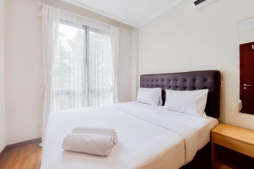 Postel nebo postele na pokoji v ubytování Modern Look 1BR at Asatti Apartment By Travelio