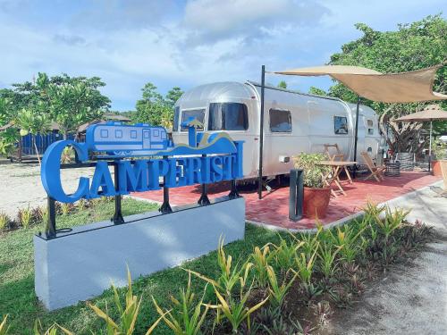 a sign that says quarantinian in front of a trailer at Camperisti Club Laiya in San Juan