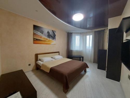 Postel nebo postele na pokoji v ubytování Романтичні апартаменти у центрі