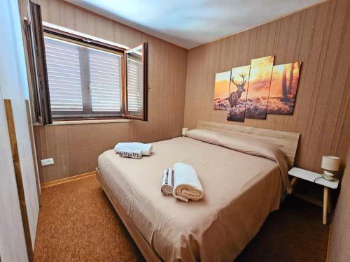 Postel nebo postele na pokoji v ubytování LORICAskiHOME