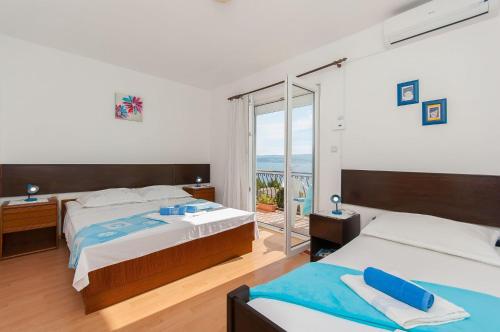 Posteľ alebo postele v izbe v ubytovaní Apartments Franka