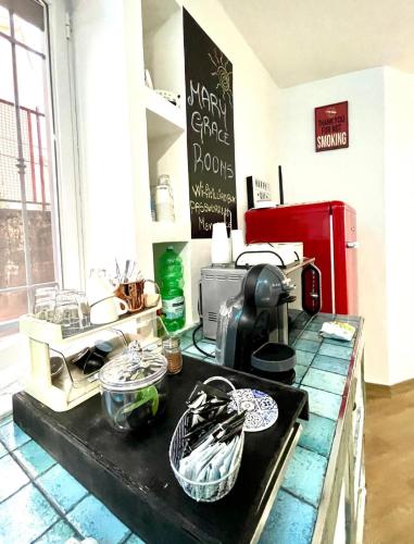 a kitchen with a counter top with a coffee maker at MaryGrace B&B in Castellammare di Stabia