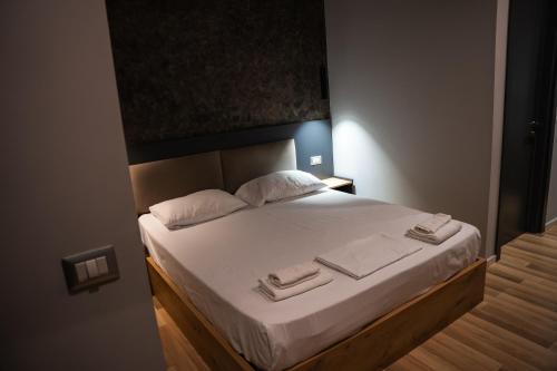 Katil atau katil-katil dalam bilik di Center Boutique Hotel