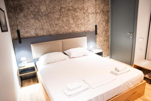 Katil atau katil-katil dalam bilik di Center Boutique Hotel