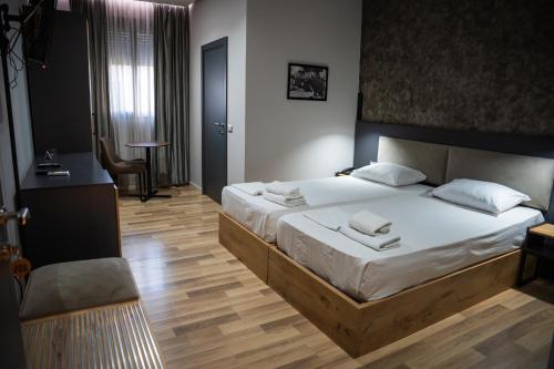 Katil atau katil-katil dalam bilik di Center Boutique Hotel