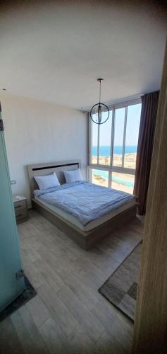 Postel nebo postele na pokoji v ubytování Duplex ilmonte galala