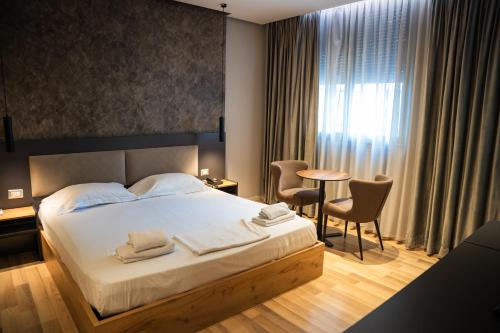Postel nebo postele na pokoji v ubytování Center Boutique Hotel