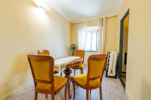 a dining room with a table and chairs at White Lerici in Lerici
