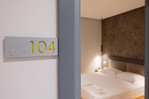Katil atau katil-katil dalam bilik di Center Boutique Hotel