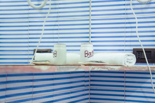 a shelf in a bathroom with white towels on it at White Lerici in Lerici
