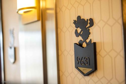 a door sign with a mouse on the door at Disney's Hollywood Hotel in Hong Kong