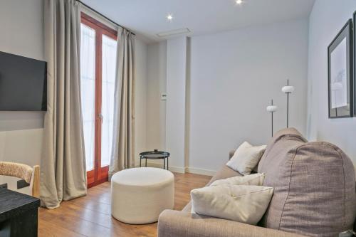 Televízia a/alebo spoločenská miestnosť v ubytovaní Uma Suites Barceloneta Beach