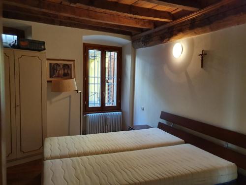 Ένα ή περισσότερα κρεβάτια σε δωμάτιο στο Casa Della Tranquillita
