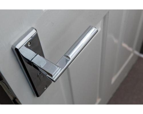 a metal towel rack on a wall at Uno Hotel Heathrow Windsor in Slough
