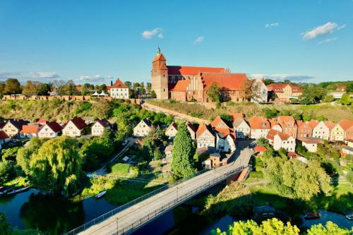 an aerial view of a town with a bridge at Das BilderbuchCafe - Ferien Apartment NO 5 - Markt 7 in Havelberg