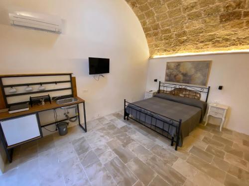 Ένα ή περισσότερα κρεβάτια σε δωμάτιο στο Residence Centro Castrignano