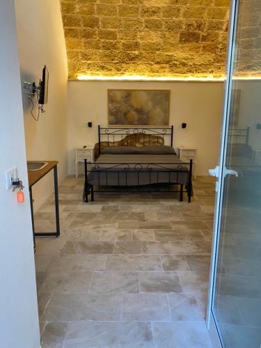 Ένα ή περισσότερα κρεβάτια σε δωμάτιο στο Residence Centro Castrignano
