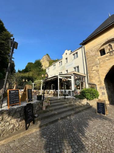a building with a staircase in front of a building at Boutique Hotel de la Ruïne in Valkenburg