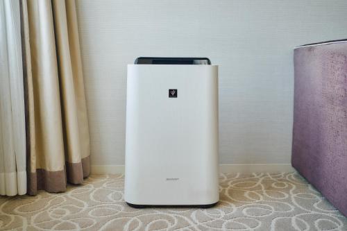 a white refrigerator sitting next to a curtain at Hotel Grand Bach Kyoto Select in Kyoto