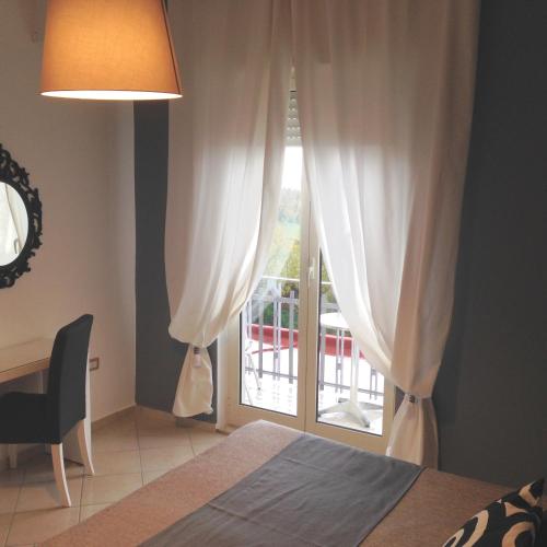 Cama o camas de una habitación en Mini Hotel - Angolo Di Paradiso -