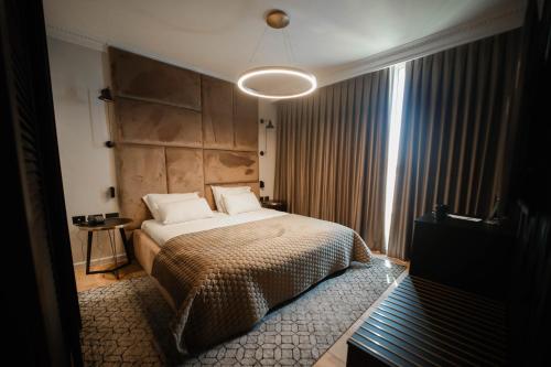 a bedroom with a large bed in a room at Plaza Nof HaGalil in Nazareth