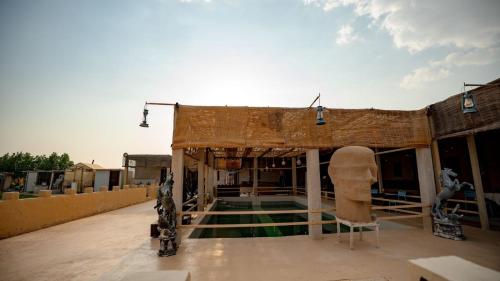 a building that is being constructed on a roof at Al Khateem Art Hub in Baţīn