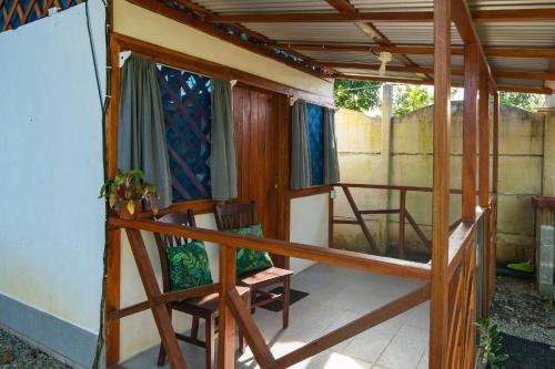 a room with two bunk beds in a house at Casa Blanca Beachfront House with Shared Pool Access Pangea Lodge in Manzanillo