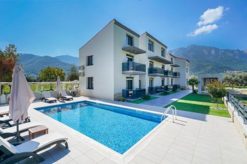 Πισίνα στο ή κοντά στο Kataleya Poolside Suites