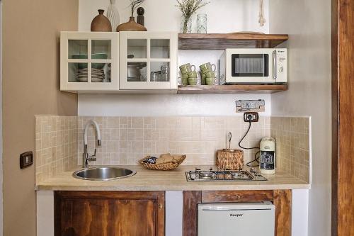 Kuchyň nebo kuchyňský kout v ubytování Corte Cenci House