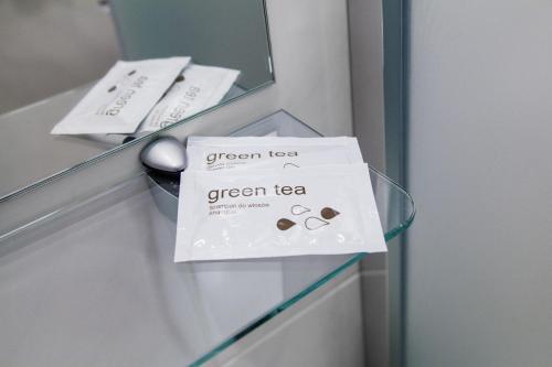 a green tea sign on a drawer in a room at Silvija House in Vilnius