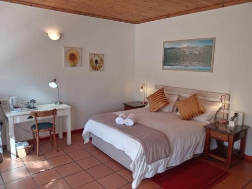 Кровать или кровати в номере Desert Rose Guesthouse