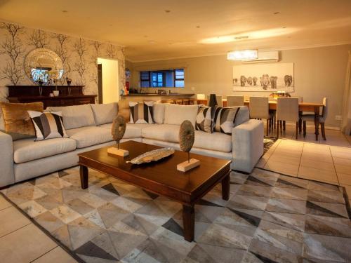 a living room with a couch and a table at Longhill Reserve in Addo