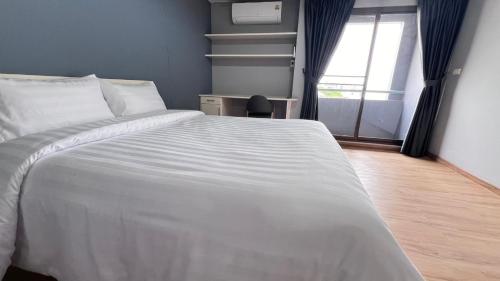 Postel nebo postele na pokoji v ubytování We Resident