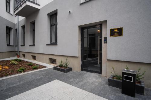 an entrance to a building with a revolving door at Dream Aparts - Wschodnia 34 in Łódź
