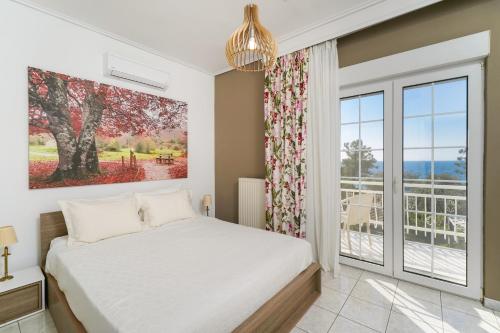 Ένα ή περισσότερα κρεβάτια σε δωμάτιο στο Villa Eleonas