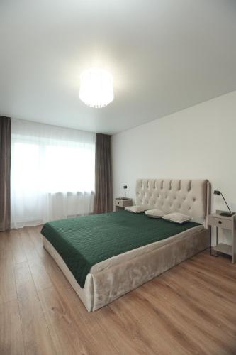 Katil atau katil-katil dalam bilik di Cozy appartment in Telsiai centre