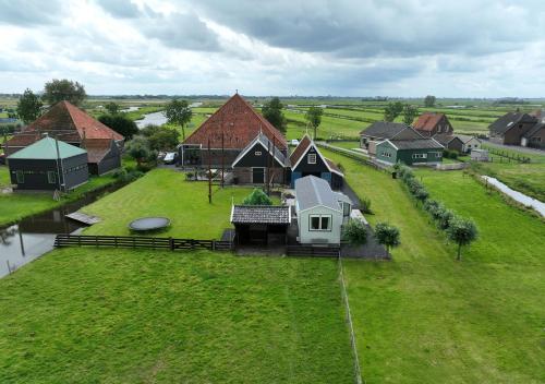 an aerial view of a house on a green field at Welcome by Bianca in Jisp